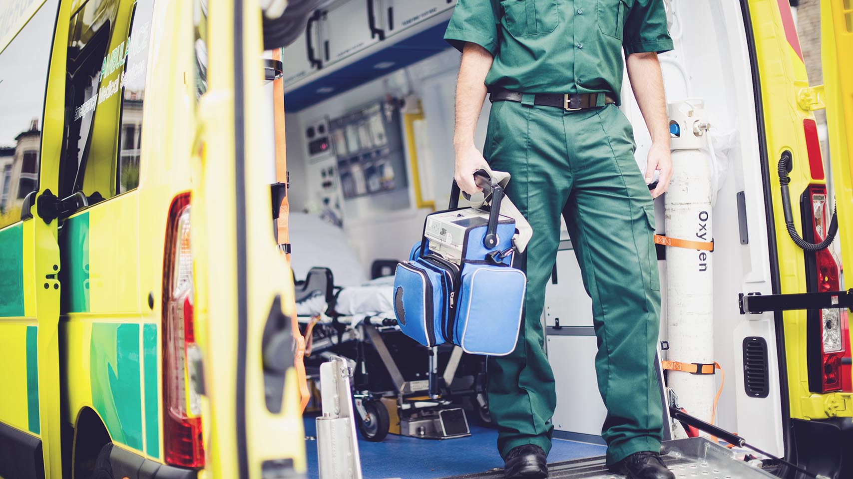 Paramedic stepping out from an ambulance